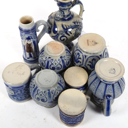 657 - A group of German Rheinware jugs and mugs, tallest 17cm