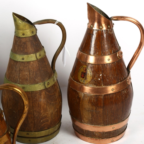 658 - 4 coopered oak Continental jugs with copper and brass bands, tallest 30cm