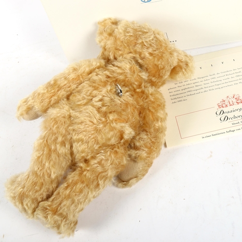 667 - A Steiff blonde teddy bear with certificate, 32cm