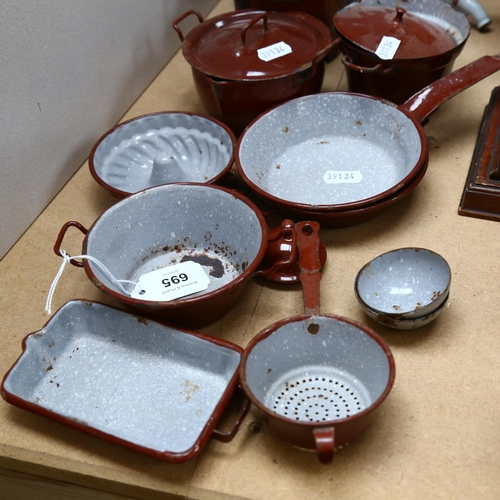 695 - A group of Vintage enamel kitchenalia, including tea strainer, jelly mould, miniature frying pan etc