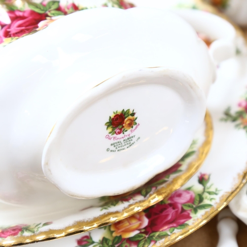 701 - Royal Albert Old Country Roses tea and dinnerware, including 23cm lidded vegetable tureen, 8 x 26cm ... 