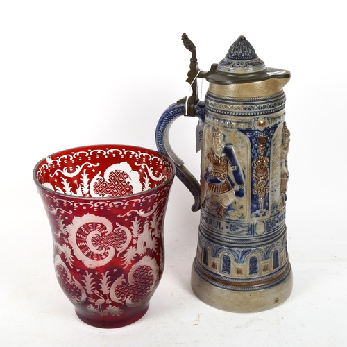 705 - An etched ruby overlay glass vase, and a large German stoneware lidded flagon, height 35cm (2)