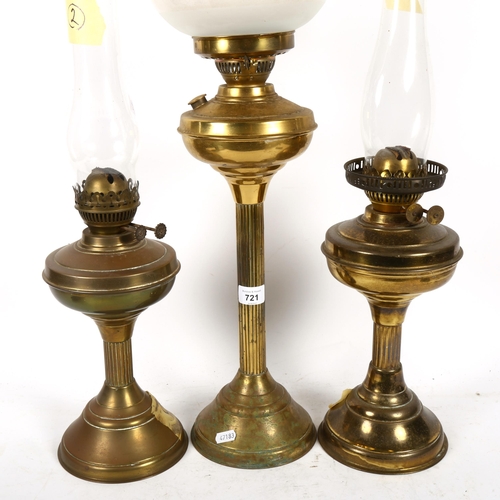 721 - A Vintage brass oil lamp, with etched frosted glass shade and chimney, height 70cm, and a pair of Du... 