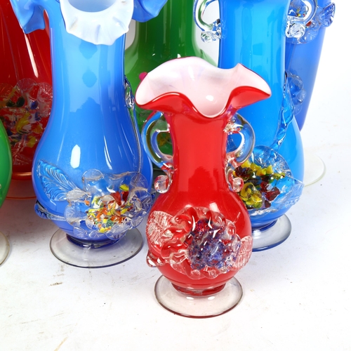 803 - A shelf of colourful 1950s glass vases with applied floral decoration, tallest 25cm