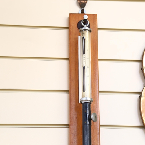 843 - A Fortin stick barometer with cylindrical glass shade, mounted on wall bracket, length 107cm