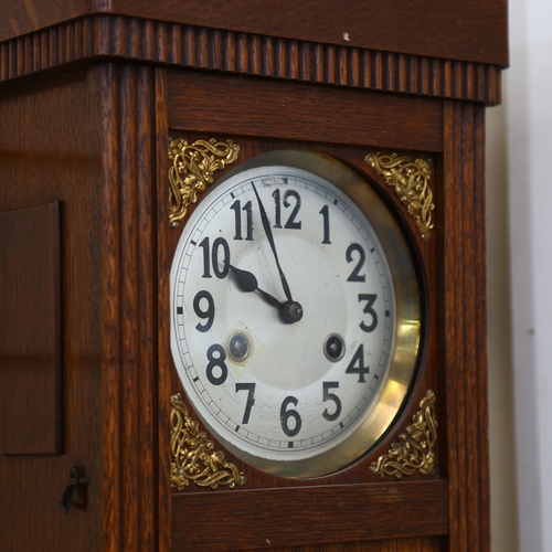 853 - A Vintage stained oak 8-day drop-dial wall clock, case height 55cm, with pendulum