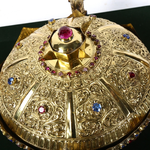 865 - A Tibetan jewelled brass ornamental crown, internal diameter 16.5cm, in display stand