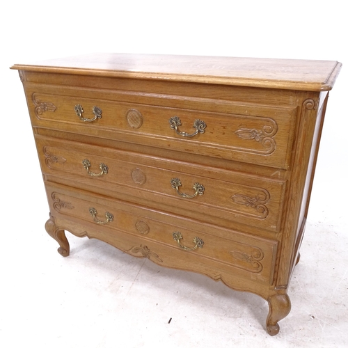 2303 - A French oak chest of 3 long drawers, with carved decoration, W101cm, H82cm, D46cm