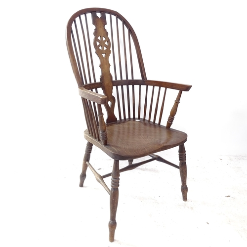 2326 - An open elm-seated wheel-back kitchen arm chair