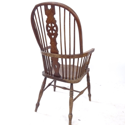 2326 - An open elm-seated wheel-back kitchen arm chair