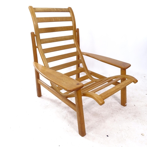 2328 - A mid-century craftsman-made oak lounge chair of stylish form, branded NB maker's monogram to rear