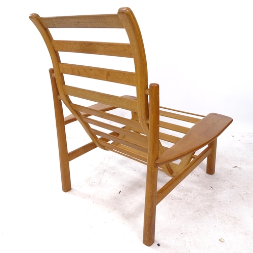 2328 - A mid-century craftsman-made oak lounge chair of stylish form, branded NB maker's monogram to rear