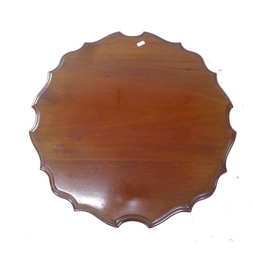 2336 - A mahogany 2-tier lamp table of shaped form, W62cm H72cm