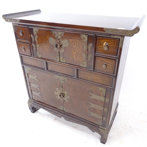 2338 - A Korean oak and elm altar cabinet, with 2 cupboards and 4 fitted drawers, W72cm, H74cm, D32cm