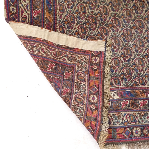 2374 - An Antique red ground Afghan rug, with symmetrical border, 155cm x 128cm