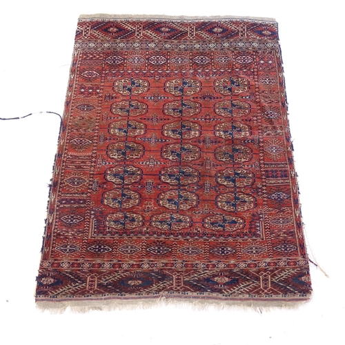 2378 - A 19th century red ground Tekke rug, 132cm x 94cm