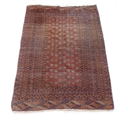 2379 - An Antique red ground Afghan rug, 164cm x 107cm