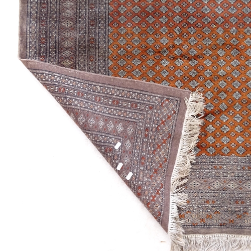 2380 - A brown ground wool Persian style rug, 182cm, x 125cm