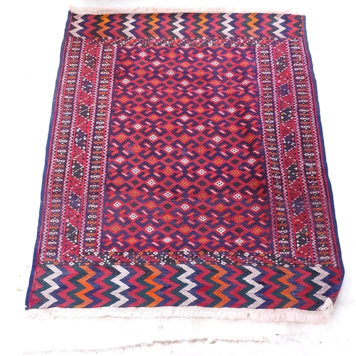 2381 - A red ground Kilim rug, with symmetrical pattern, 148cm x 118cm