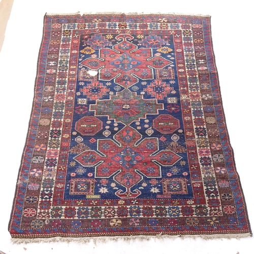 2382 - A red ground Kasak Caucasian rug, 180cm x 140cm