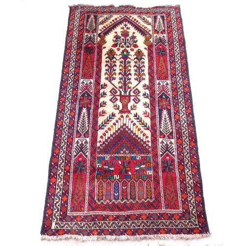 2385 - A red ground Iranian Beluchi prayer rug, 200cm x 102cm