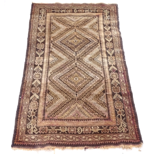 2386 - A brown ground Persian design rug, 190cm x 115cm