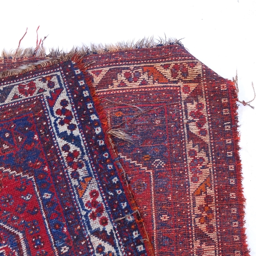 2389 - A red ground Shiraz runner, 300cm x 118cm