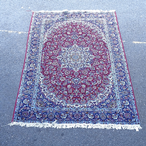 2396 - A modern machine-made red and blue ground Kashmiri carpet, 290cm x 186cm