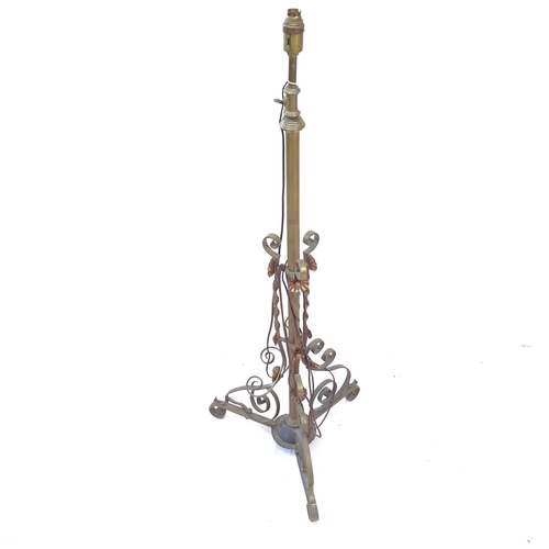 2401 - A brass telescopic standard lamp on tripod base, maximum height to bayonet fitting 155cm