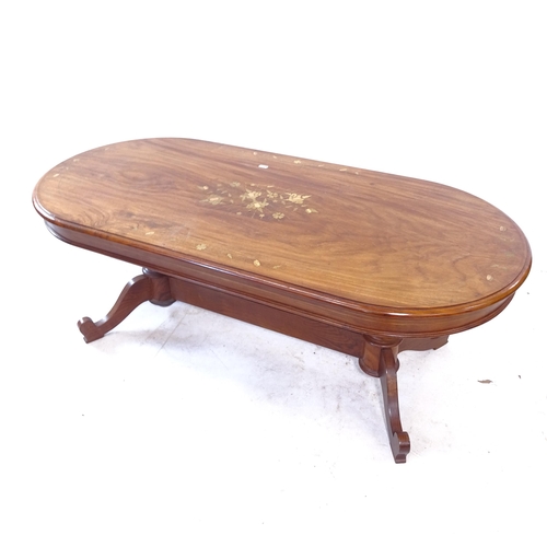 2402 - A modern Indian hardwood oval coffee table, with brass and copper floral inlay, L121cm, H45cm, D56cm