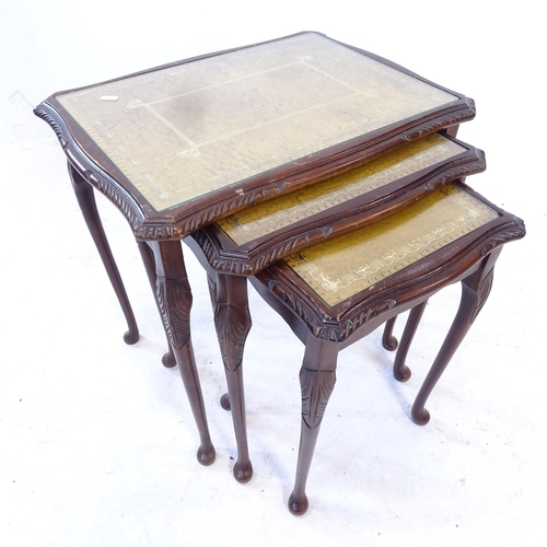 2407 - A reproduction mahogany nest of 3 tables, with inset glass tops, largest W56cm, H56cm, D43cm