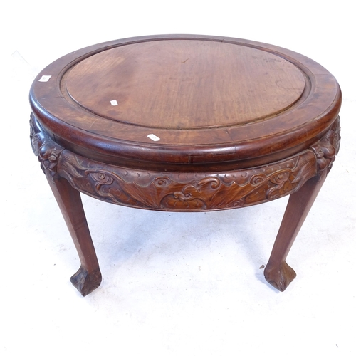 2409 - A Chinese hardwood circular occasional table, with carved decoration, and claw and ball feet, D80cm,... 