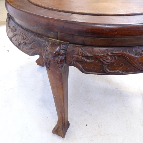 2409 - A Chinese hardwood circular occasional table, with carved decoration, and claw and ball feet, D80cm,... 