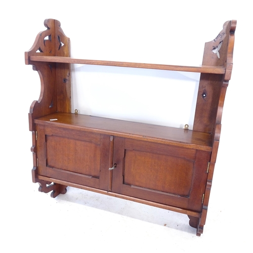 2412 - An early 20th century mahogany hanging cabinet