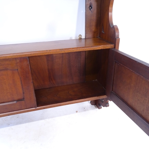 2412 - An early 20th century mahogany hanging cabinet