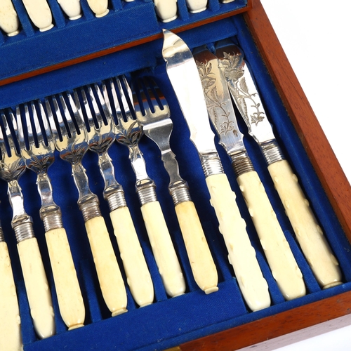 1207 - A Victorian canteen of fish cutlery for 12 people, with engraved blades and bone handles, in fitted ... 