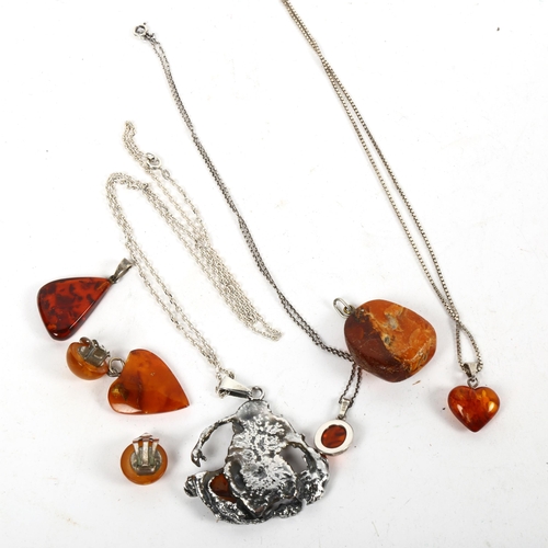 1283 - An unusual abstract design silver and amber pendant necklace, amber clip-on earrings etc