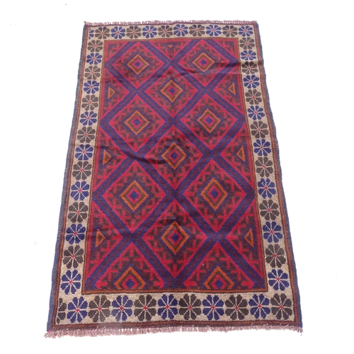 2305 - A red and blue ground Baluchi rug, 147cm x 90cm