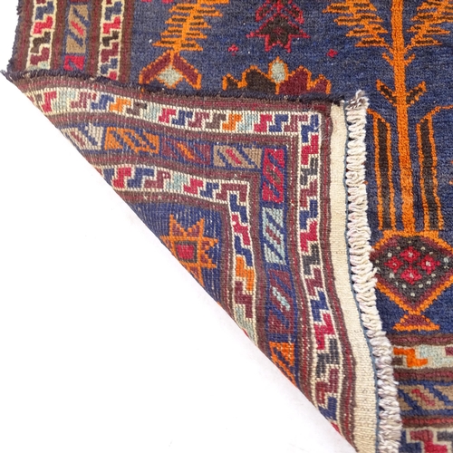 2312 - A blue ground Baluchi rug, 113cm x 84cm