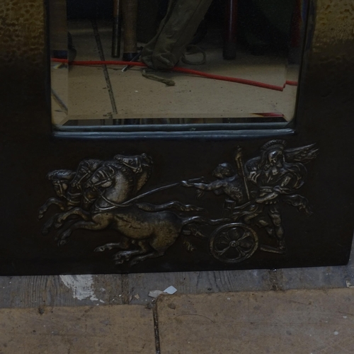 1918 - An anodised metal-framed wall mirror, circa 1920, with relief embossed Roman chariot design, 75cm x ... 