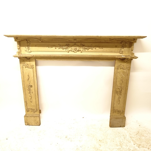 2725 - A Victorian painted pine fire surround, with applied scrolled decoration, W155cm, H130cm, rebate wid... 