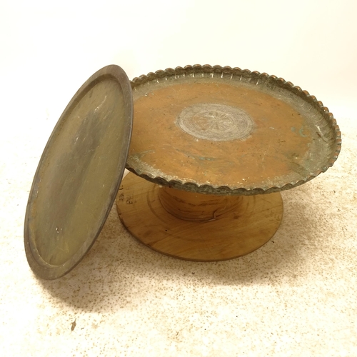 2732 - An Eastern design copper and brass tray-top table, on cable spool base, D69cm, H35cm, and another pa... 