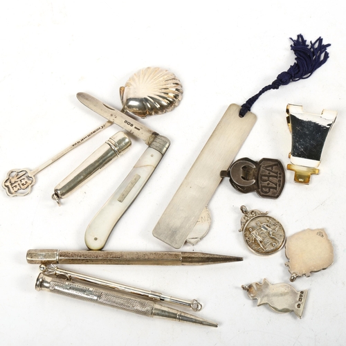 1316 - A group of silver items, to include fobs, ARP badge, bookmark, propelling pencils, swizzle stick, an... 