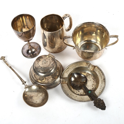 1323 - A group of silver presentation pieces, to include christening mug, a 2-handled sugar bowl, an ashtra... 