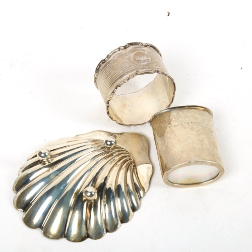 1329 - A small shell design silver butter dish, a silver napkin ring, and an Art Nouveau silver pot with mo... 