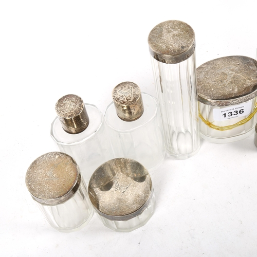 1336 - 8 various glass dressing table bottles, all with French silver lids (1 A/F)