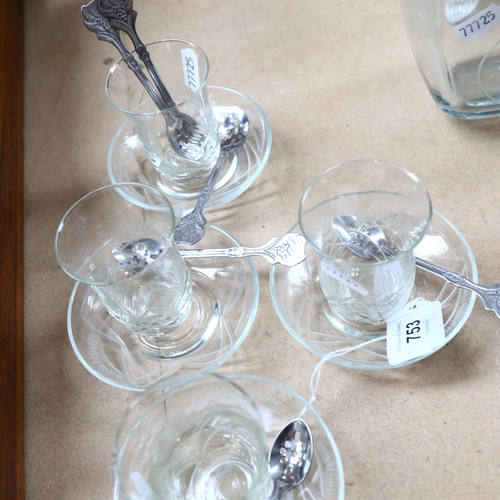 753 - A set of 4 engraved coffee glasses and saucers, with a set of 6 white metal spoons