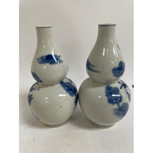 541 - A pair of Chinese blue and white double-gourd vases, 1 with 4 character mark, height 19cm