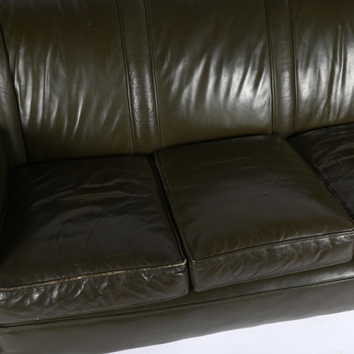 1551 - A 1940s' green leather club style 3 seat sofa, on casters length 180cm, height 82cm