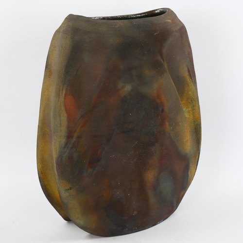 1573 - A studio pottery raku fired vase, signed to base, height 29cm